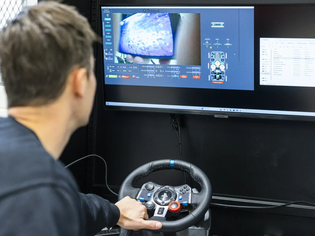 Eivind Eidissen demonstrates remote control of Trosvik’s MultiCleaner at the company’s ROV lab in Brevik.